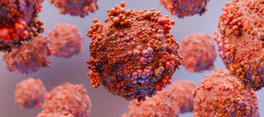 Mikroskop altında detaylı şekilde gösterilmiş, HIV virüsünü temsil eden kırmızımsı küresel yapılar